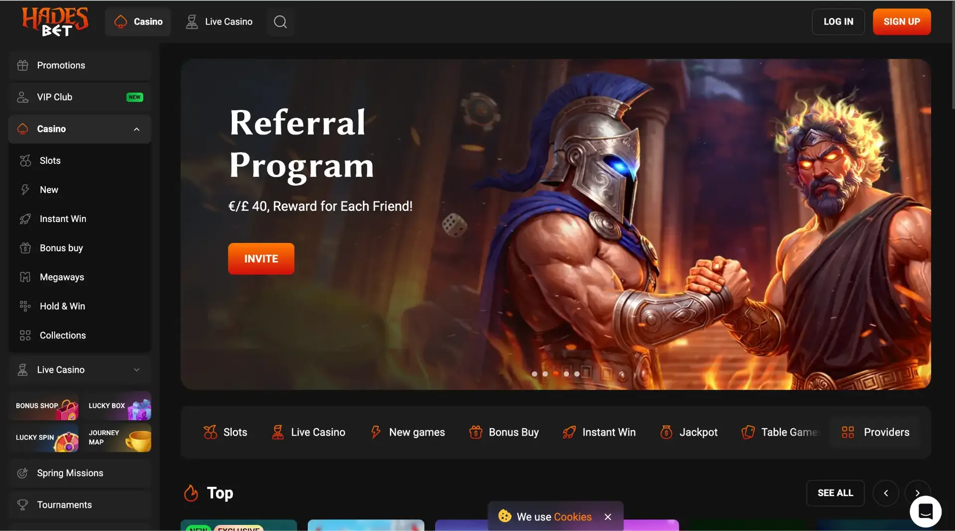 HadesBet homepage showing a referral programme offering 40 pounds for each friend, with casino, live casino and slots navigation